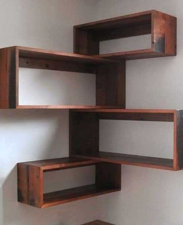Stylish wall-mounted wooden shelves by Top Residential Builders in Karanodai