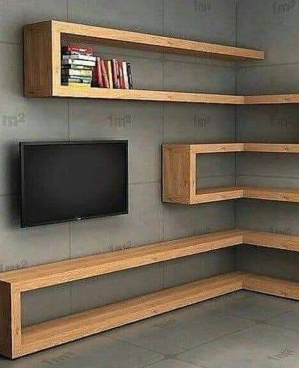 Modern wooden TV unit and shelving design by Affordable Residential Builders in Redhills